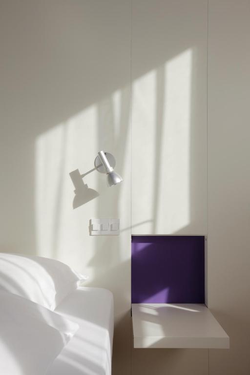 Postel nebo postele na pokoji v ubytování Hotel Dom - das Hotel mit dem Integrationskonzept