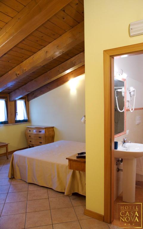 Postel nebo postele na pokoji v ubytování Hotel Casanova