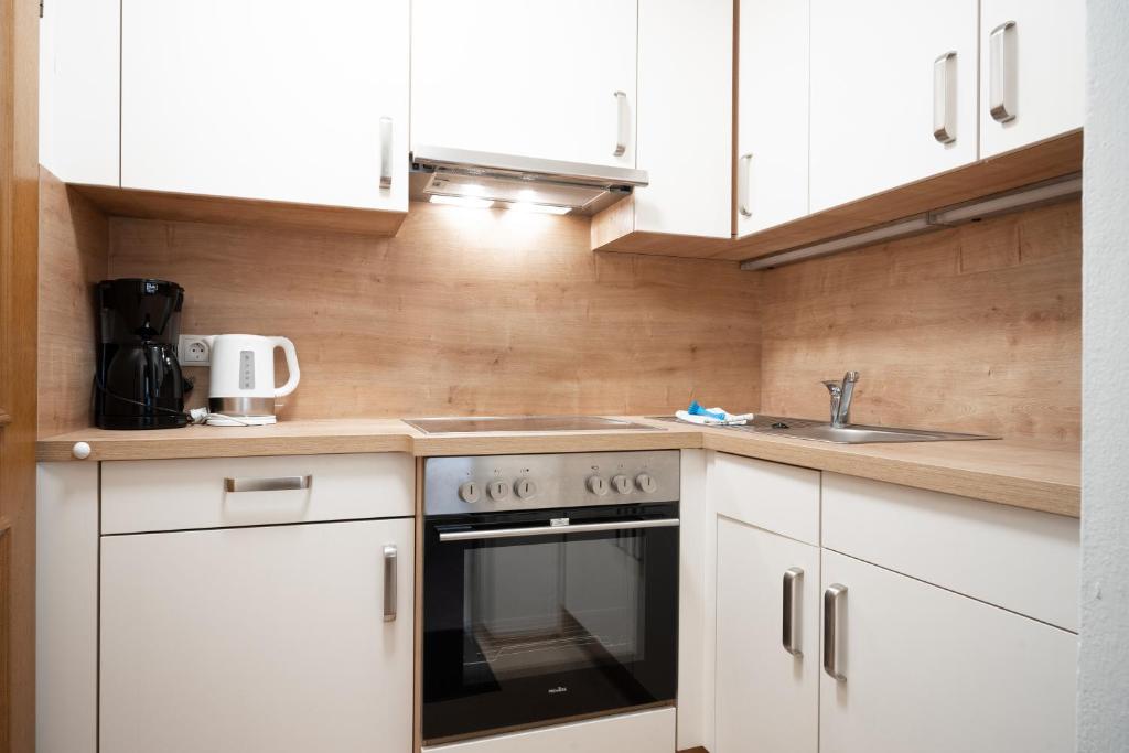 Kuchyňa alebo kuchynka v ubytovaní Seilergasse Apartments by we rent, SUMMERCARD INCLUDED