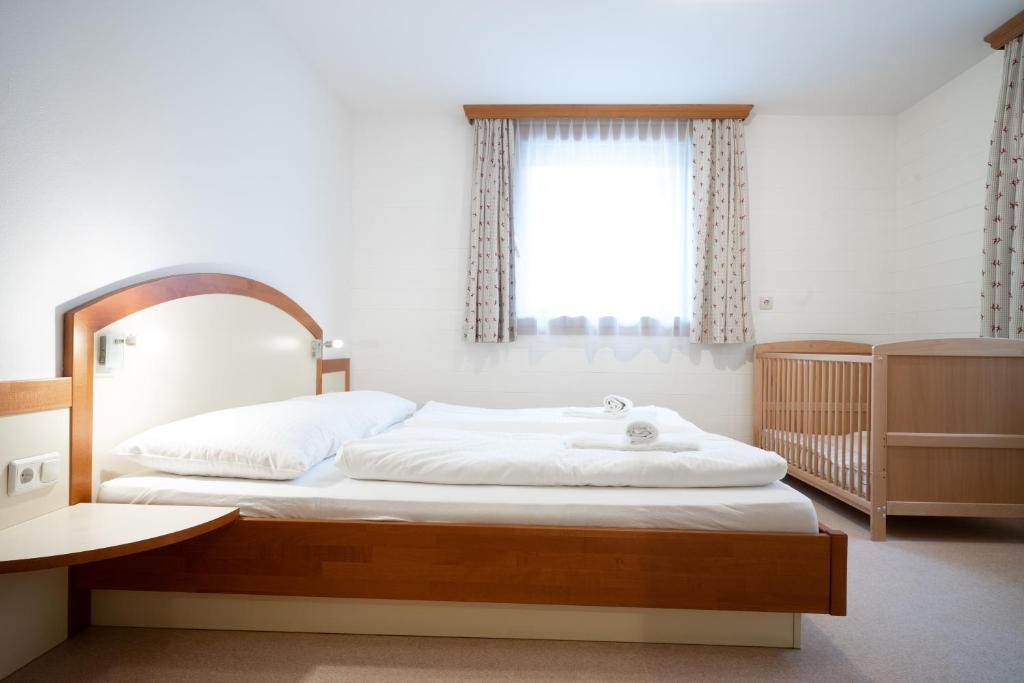 Posteľ alebo postele v izbe v ubytovaní Seilergasse Apartments by we rent, SUMMERCARD INCLUDED