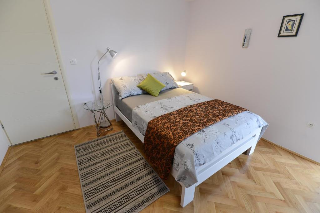 Łóżko lub łóżka w pokoju w obiekcie Apartment Rocky I