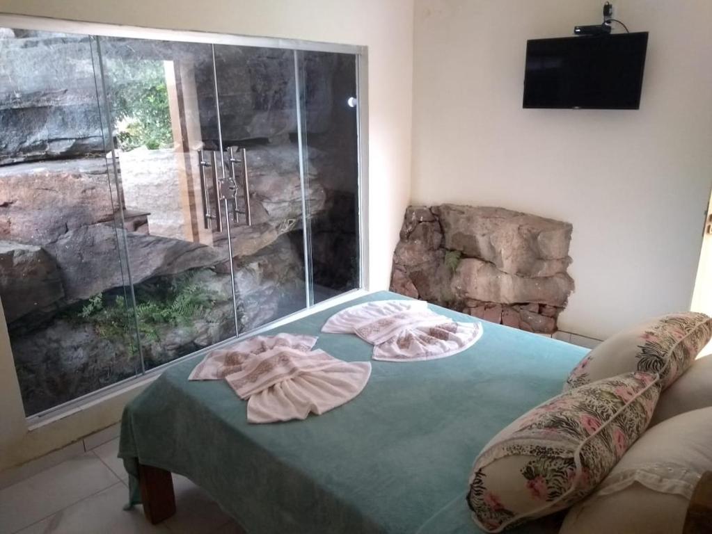 Postel nebo postele na pokoji v ubytování Cafe Preto Pousada e Bistrô