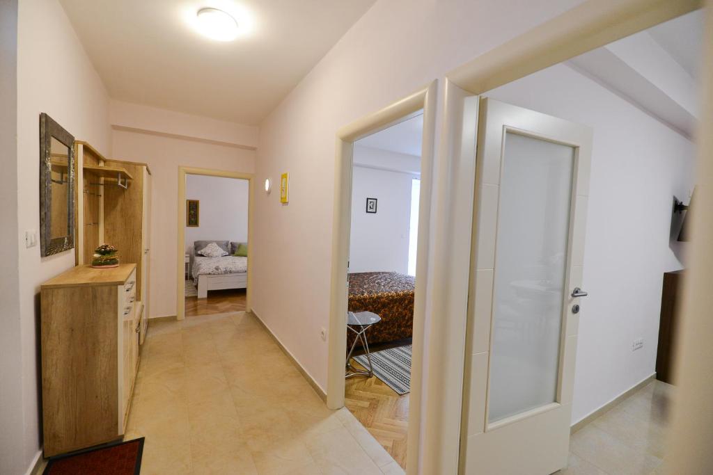 Łóżko lub łóżka w pokoju w obiekcie Apartment Rocky I