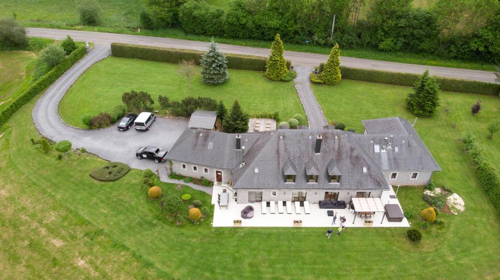 an aerial view of a large house with a yard at B&B Madoli in Érezée