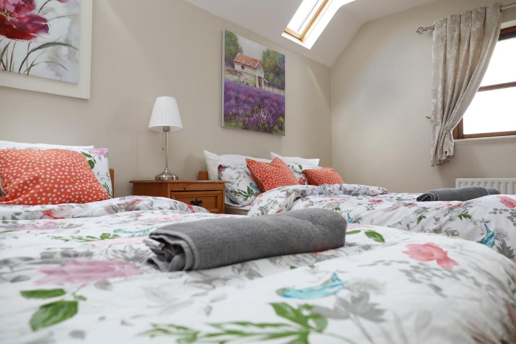 Cama o camas de una habitación en Alices Loft & Cottages