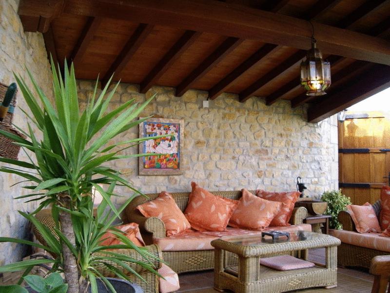 a living room with a couch and a table at Posada Mar de Santillana in Ubiarco