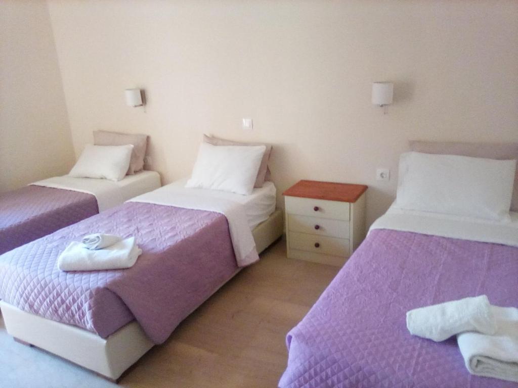 Postel nebo postele na pokoji v ubytování Gorgona apartments & studios