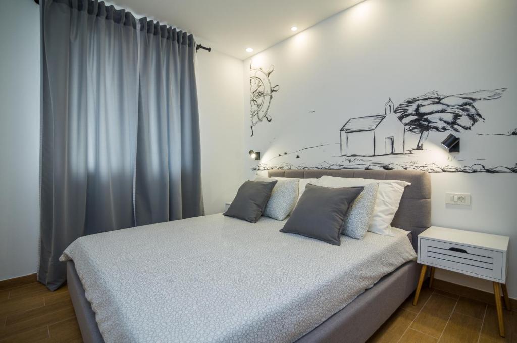 Postel nebo postele na pokoji v ubytování FK Apartments