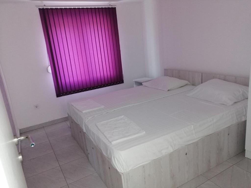 Postel nebo postele na pokoji v ubytování Apartments Stevanovic
