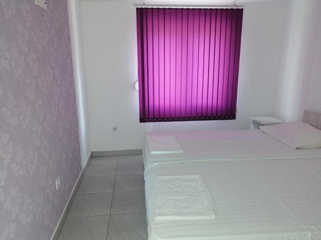 Postel nebo postele na pokoji v ubytování Apartments Stevanovic