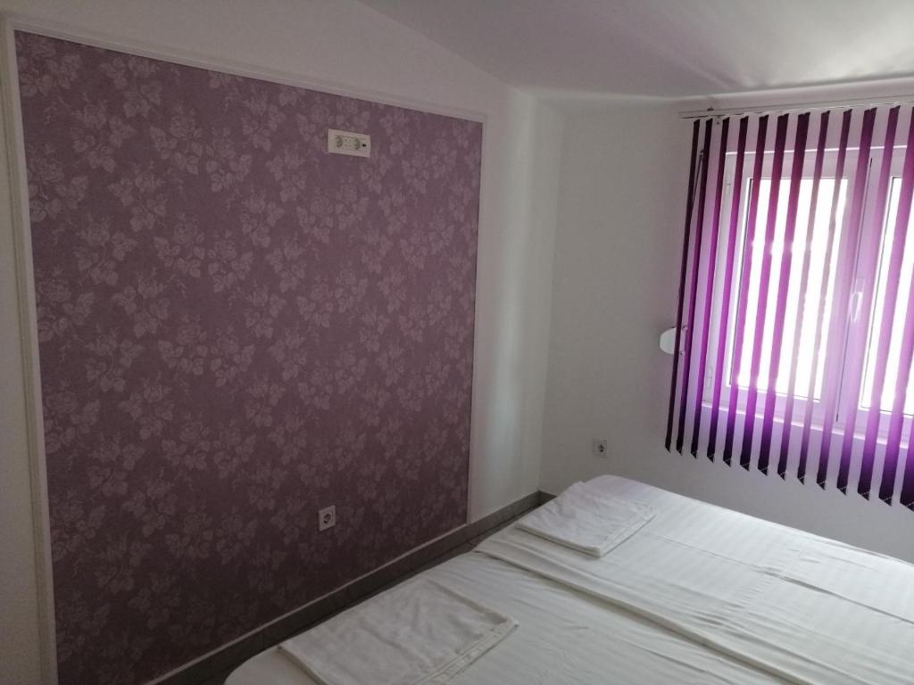 Postel nebo postele na pokoji v ubytování Apartments Stevanovic