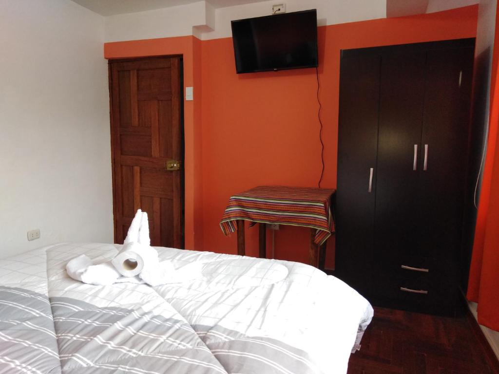 Postel nebo postele na pokoji v ubytování Kaboka Cusco Hospedaje Familiar