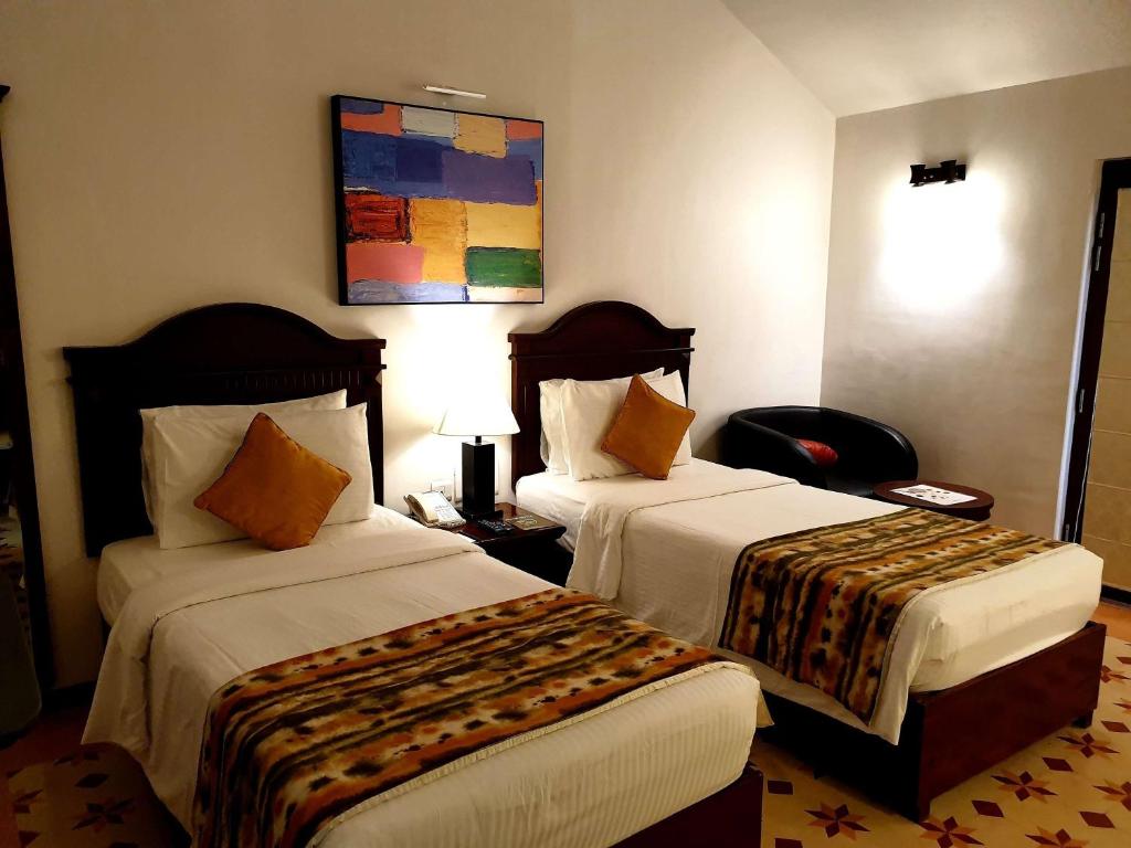 Postel nebo postele na pokoji v ubytování Novotel Goa Dona Sylvia Resort