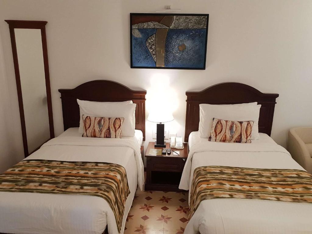 Postel nebo postele na pokoji v ubytování Novotel Goa Dona Sylvia Resort