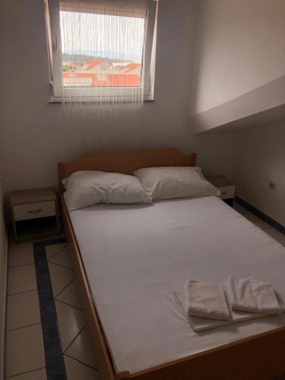 Postel nebo postele na pokoji v ubytování Ari Apartments