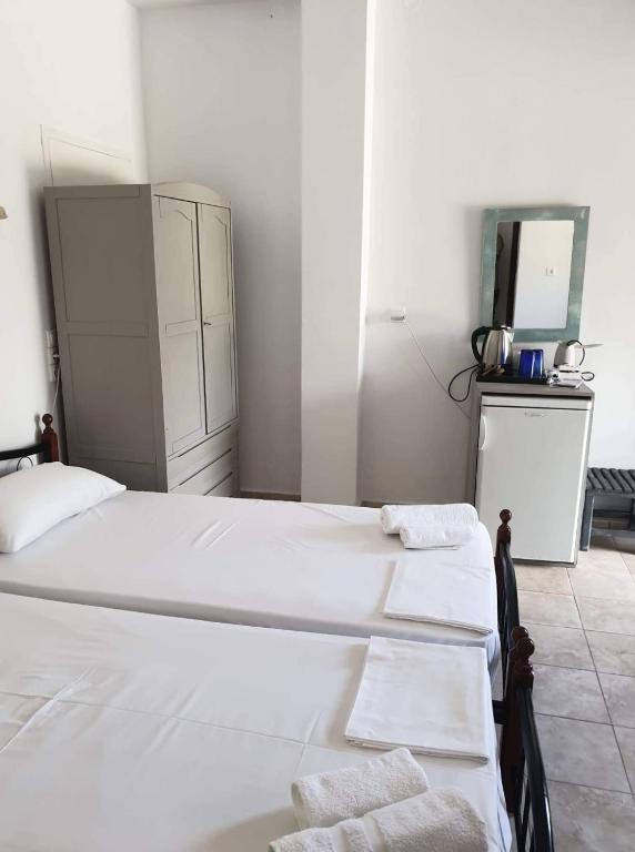 Postel nebo postele na pokoji v ubytování Akti Rooms And Studios