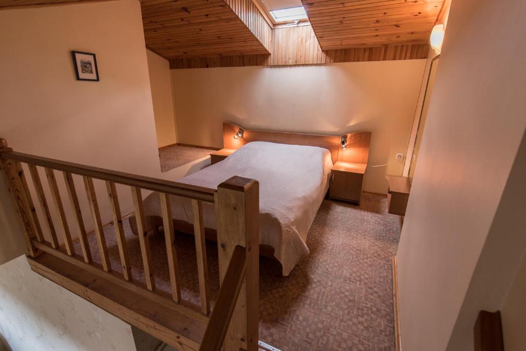 Postel nebo postele na pokoji v ubytování Vila Flora