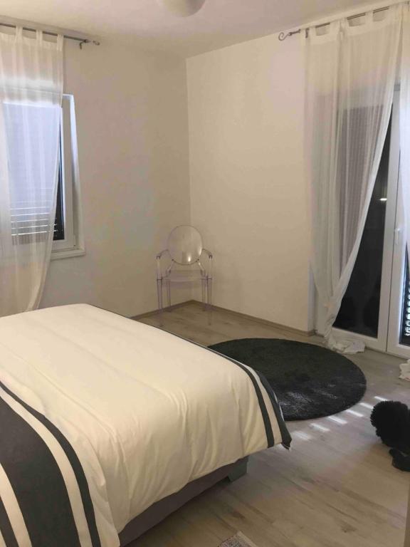 Postel nebo postele na pokoji v ubytování Villa Lorenta Apartments