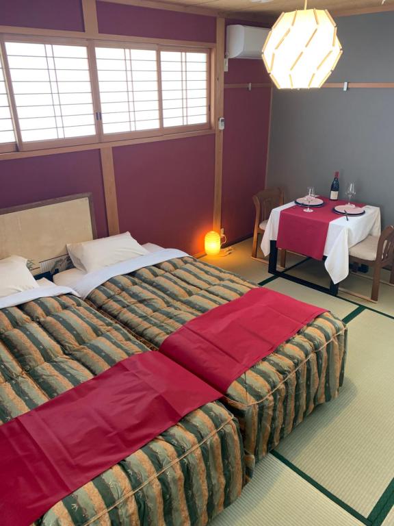 Postel nebo postele na pokoji v ubytování オーベルジュ美の浜 流石