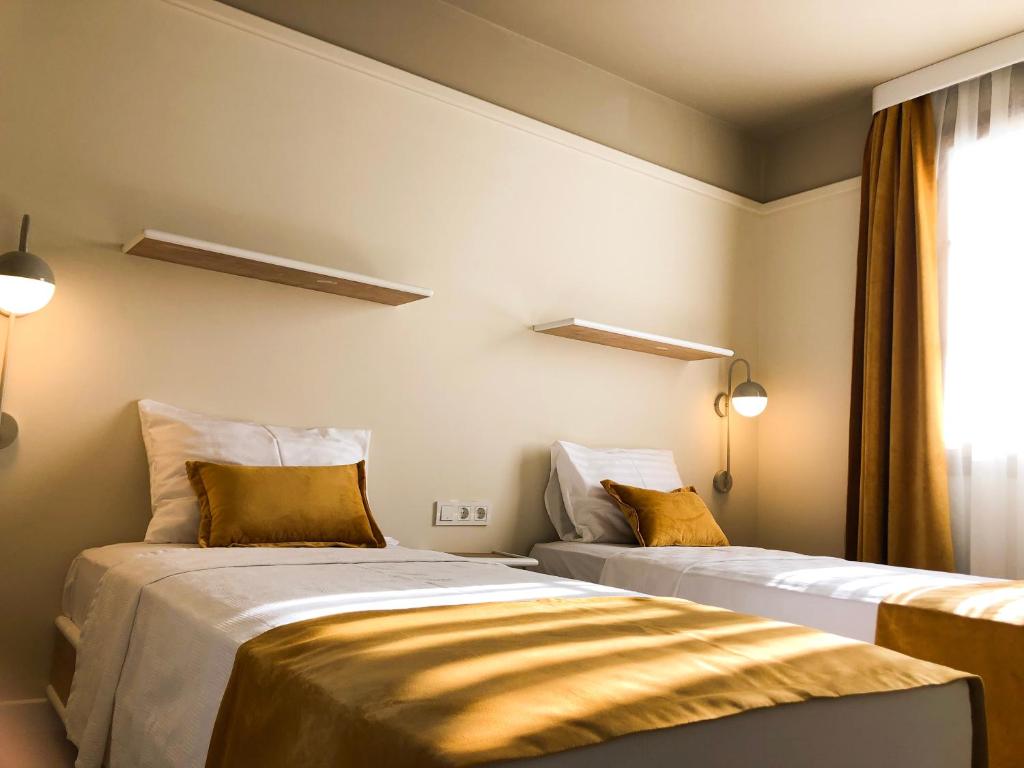 A bed or beds in a room at Oda Bodrum Gümüşlük