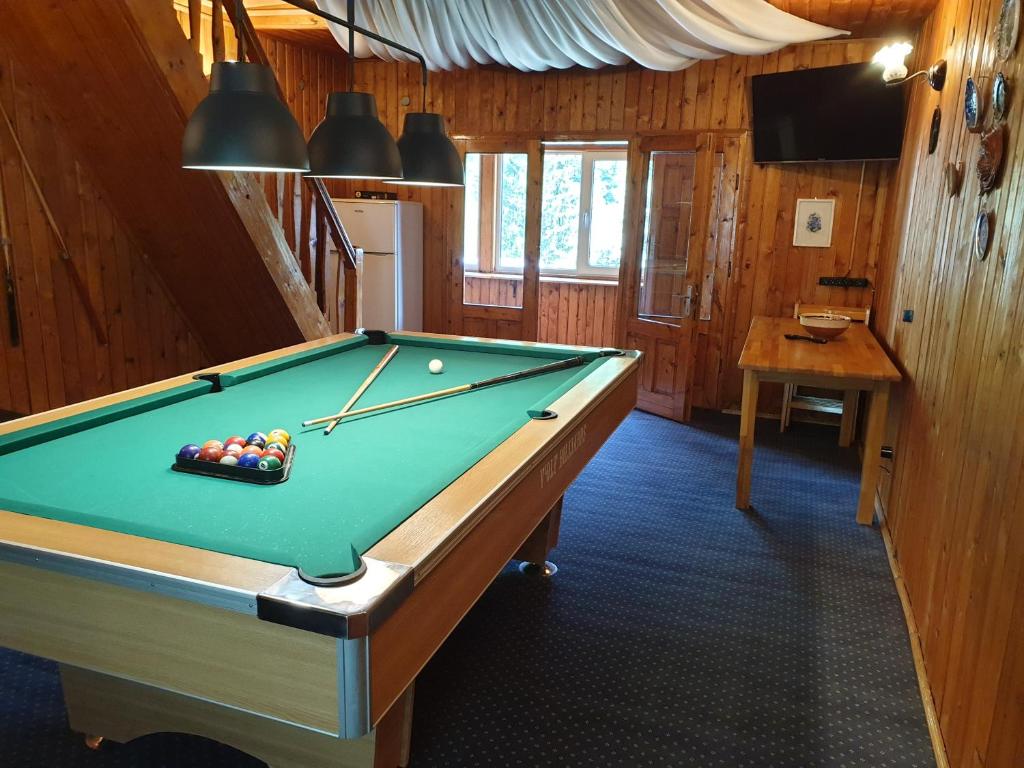 a pool table in the middle of a room at Vila Lucica in Sinaia