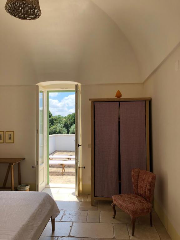 Postel nebo postele na pokoji v ubytování Masseria Fenicia