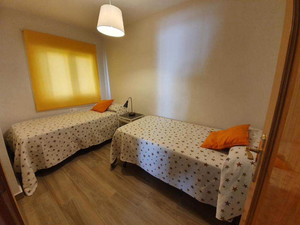 Posteľ alebo postele v izbe v ubytovaní Gálvez Flat, Principal Railway Station Málaga