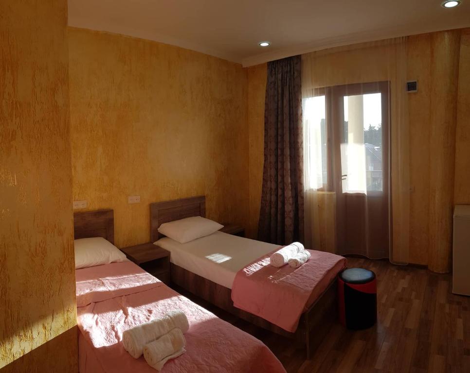 Postel nebo postele na pokoji v ubytování Guest House MARINA