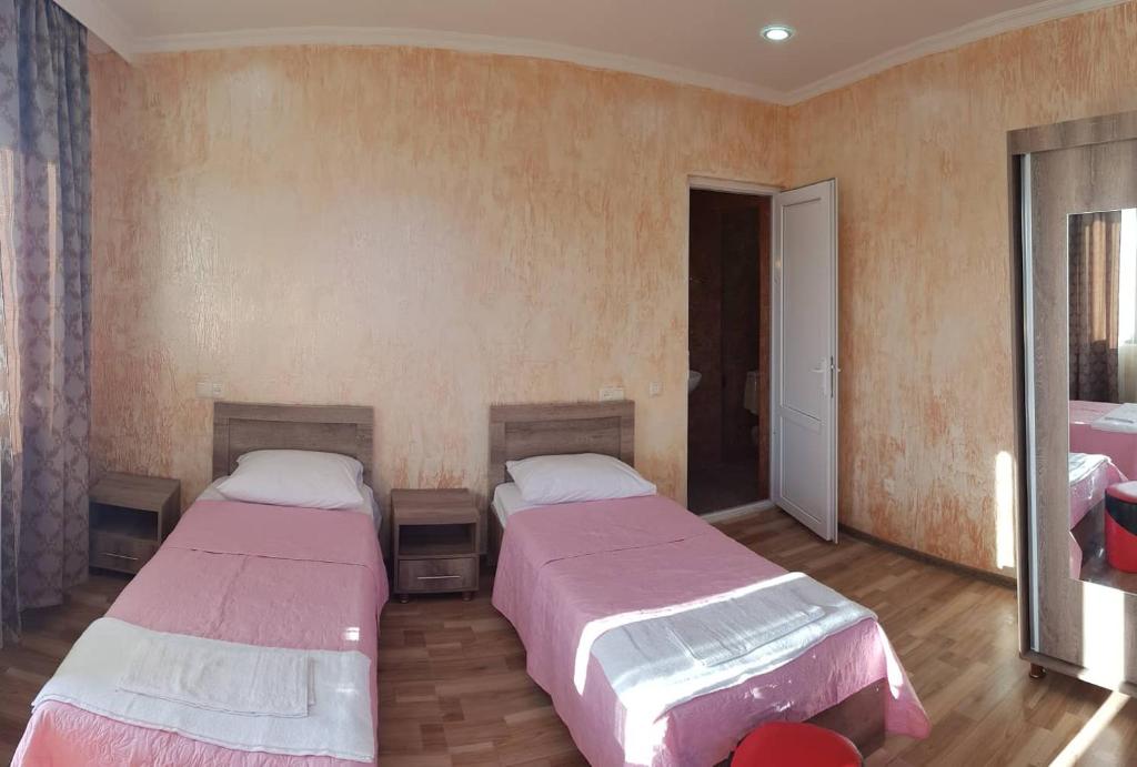 Postel nebo postele na pokoji v ubytování Guest House MARINA