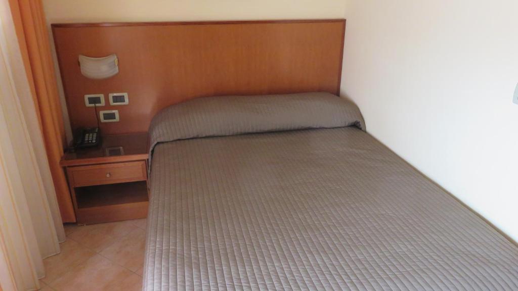 Postel nebo postele na pokoji v ubytování Hotel Oasi Dei Discepoli