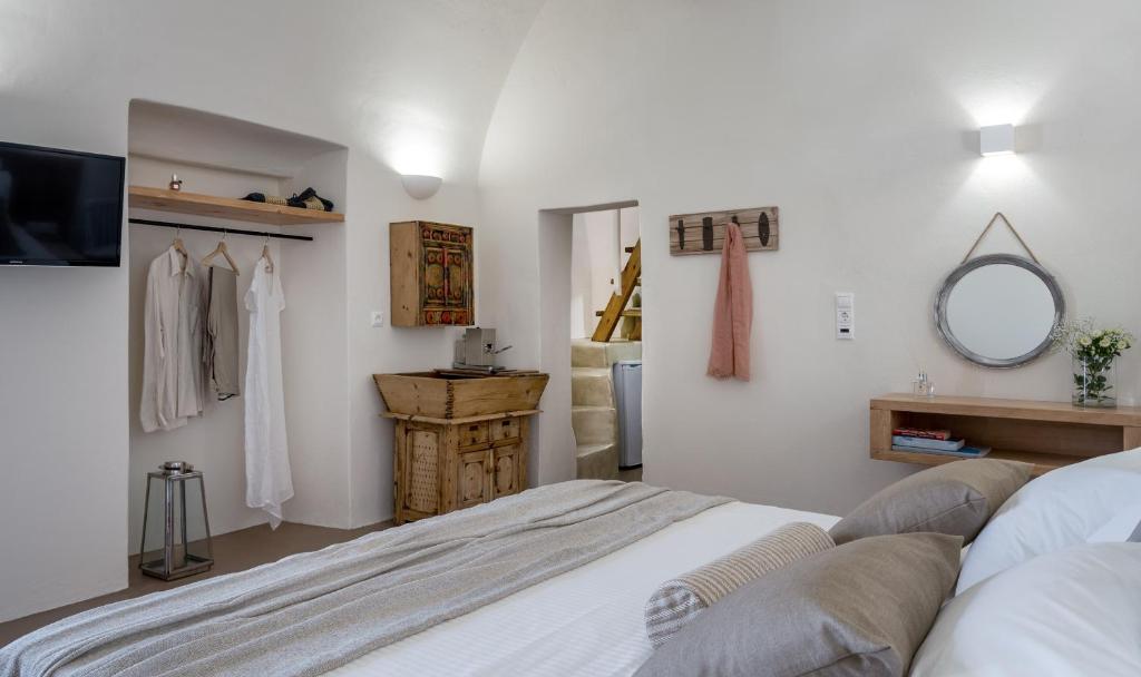 Postel nebo postele na pokoji v ubytování Nalas Suites