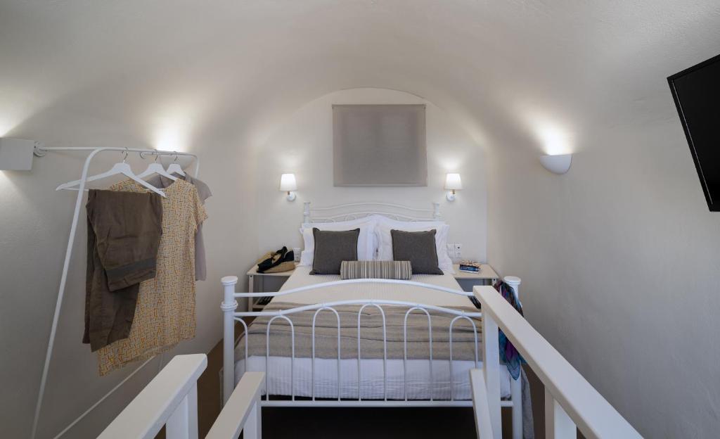 Postel nebo postele na pokoji v ubytování Nalas Suites