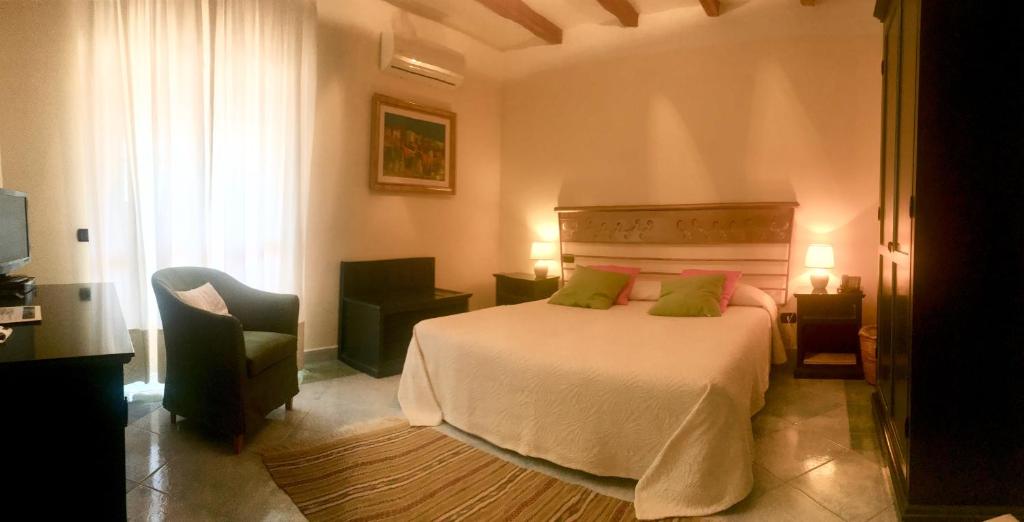 Postel nebo postele na pokoji v ubytování Hotel Su Lithu