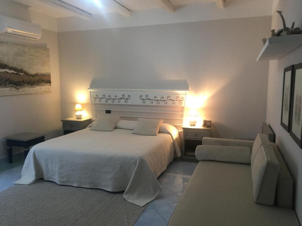 Postel nebo postele na pokoji v ubytování Hotel Su Lithu