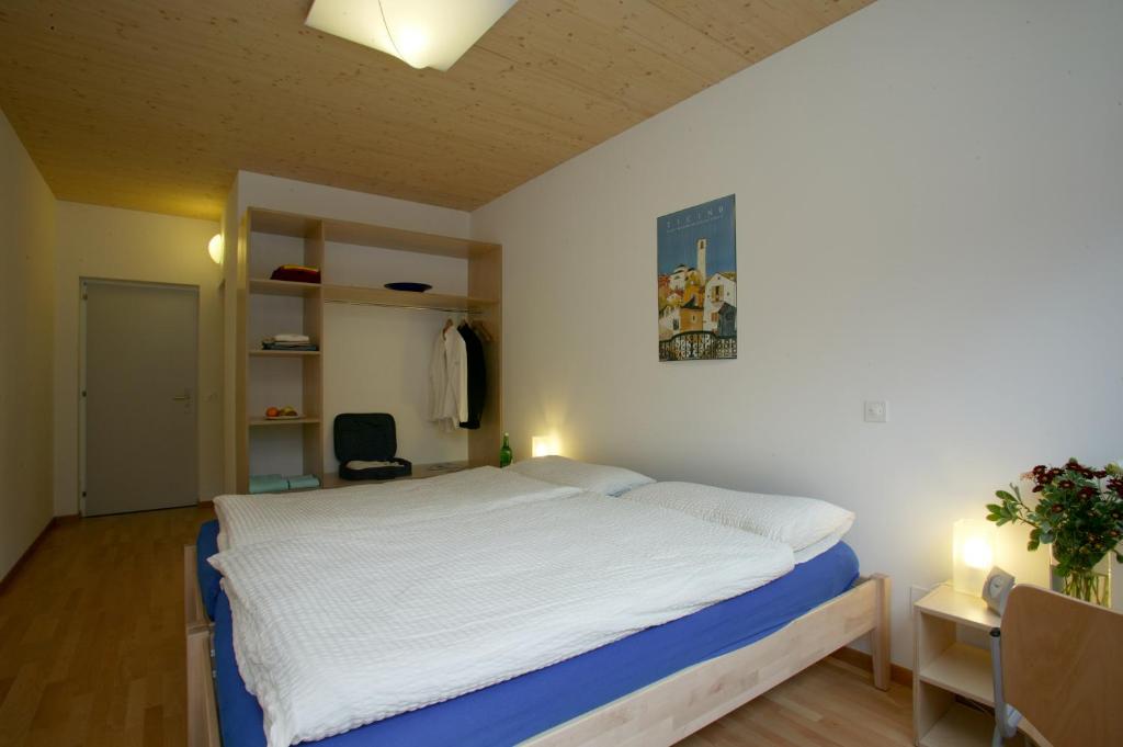 Postel nebo postele na pokoji v ubytování Eco-Hotel Cristallina