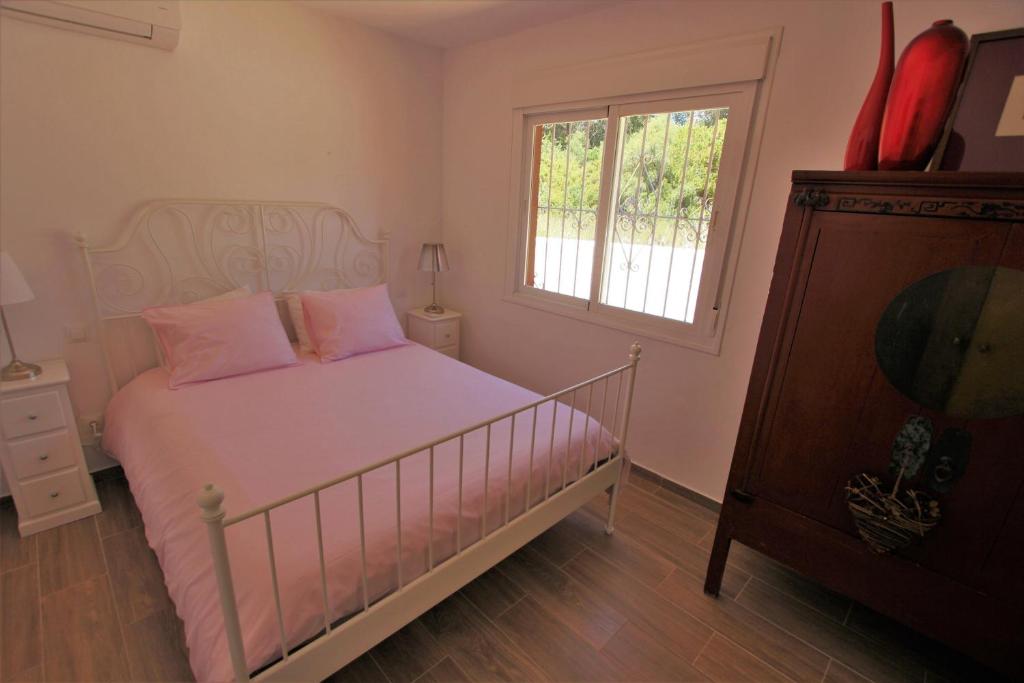 Postel nebo postele na pokoji v ubytování villa in puerto banus