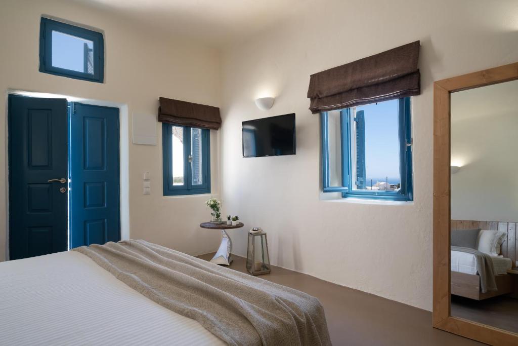 Postel nebo postele na pokoji v ubytování Nalas Suites