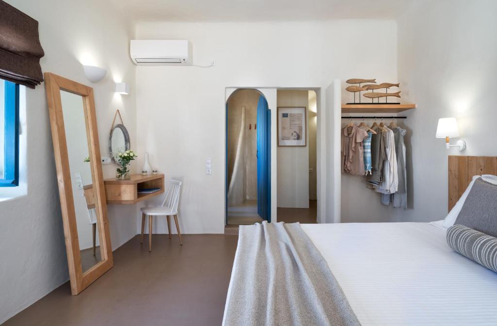Postel nebo postele na pokoji v ubytování Nalas Suites