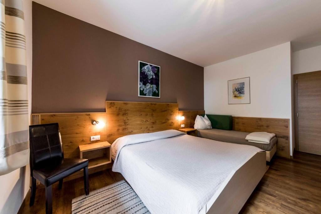 Łóżko lub łóżka w pokoju w obiekcie Appartement Haidacher