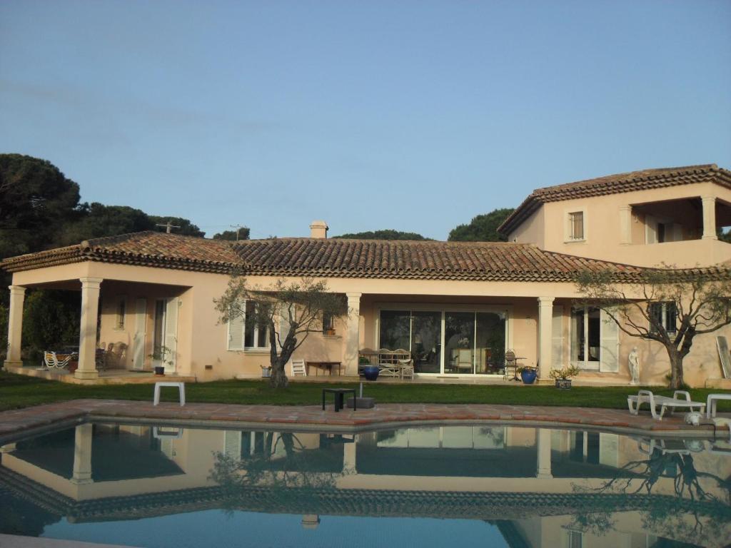 a house with a swimming pool in front of it at 1321 Route de l'Escalet villa les oliviers in Ramatuelle