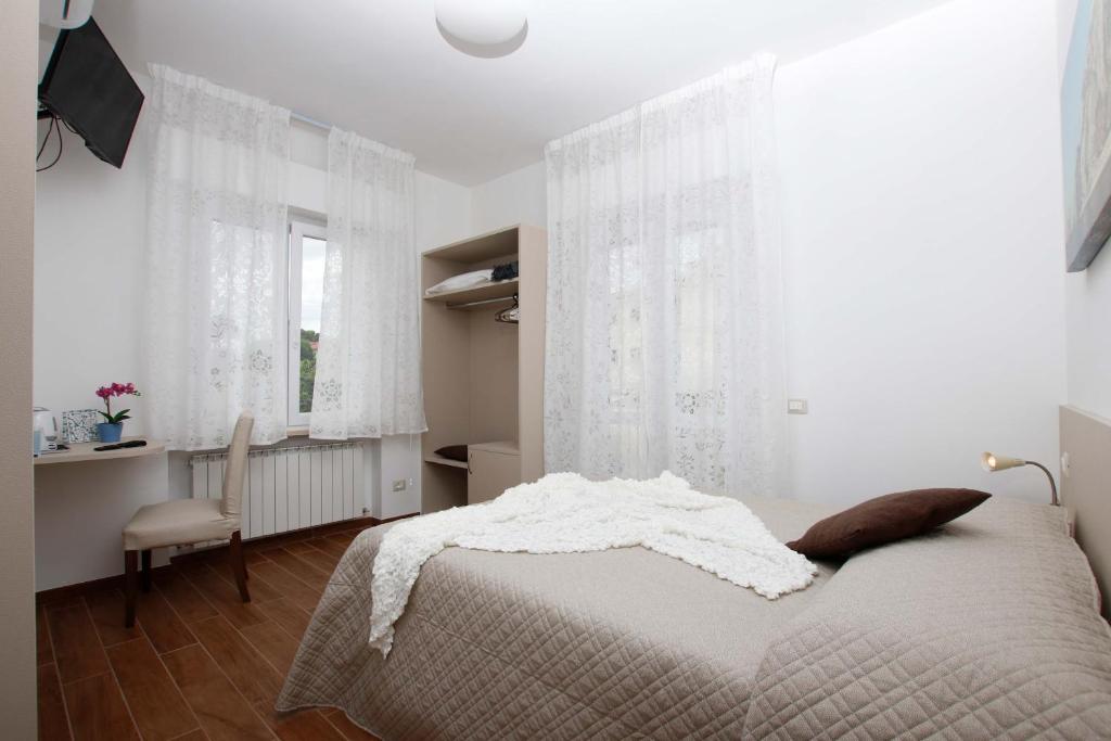 Łóżko lub łóżka w pokoju w obiekcie Affittacamere da Sabri
