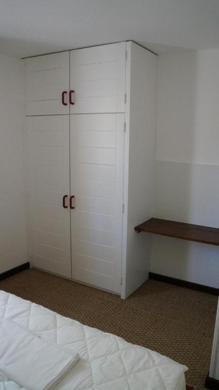 a room with two closets and a bed in it at Clos l&#39;Oustal in Labastide-de-Virac