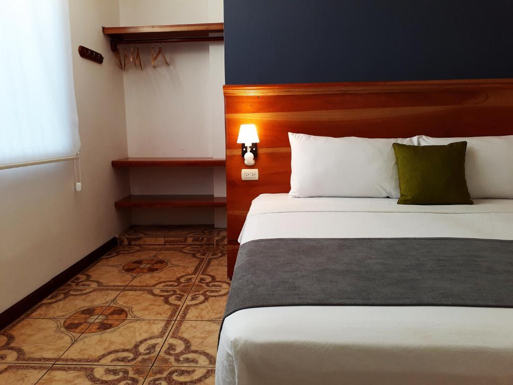 Postel nebo postele na pokoji v ubytování Casa D´Cristhi