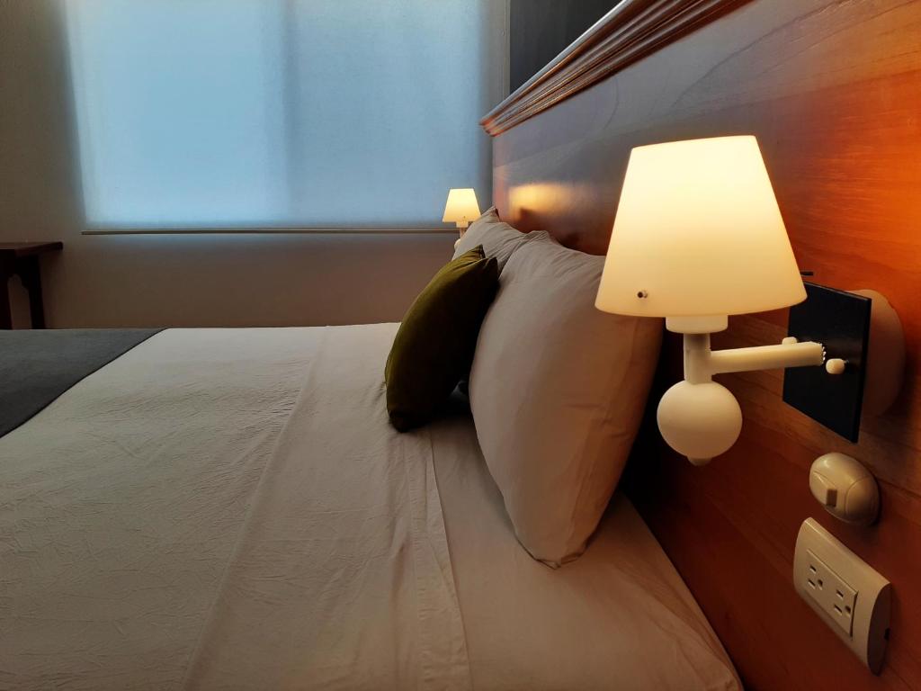 Postel nebo postele na pokoji v ubytování Casa D´Cristhi