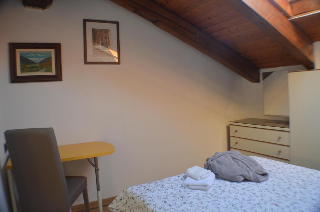 Łóżko lub łóżka w pokoju w obiekcie Appartamento Mara