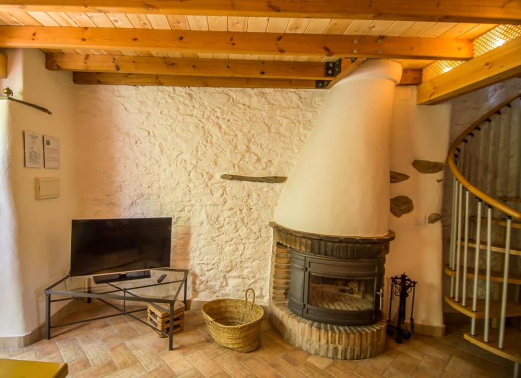 Televízia a/alebo spoločenská miestnosť v ubytovaní Casa con encanto en Alájar