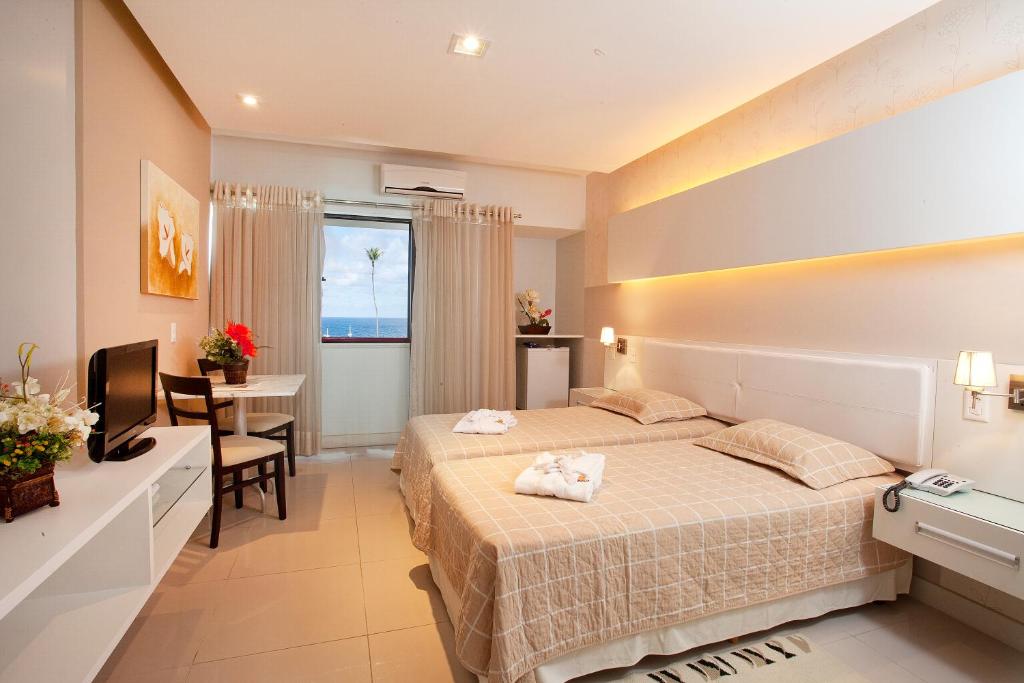 Postel nebo postele na pokoji v ubytování Bahiamar Hotel