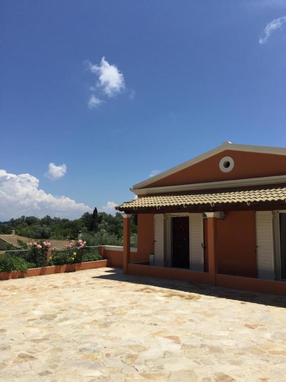 a view of a house with a patio at Eleana's apartments in Gouvia