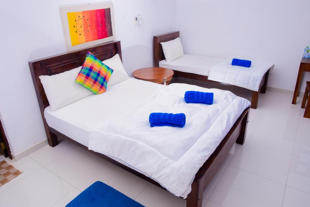 Postel nebo postele na pokoji v ubytování Homestay Garden Rest Kandy
