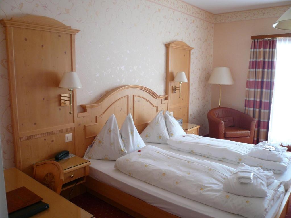 Postel nebo postele na pokoji v ubytování Hotel Cresta